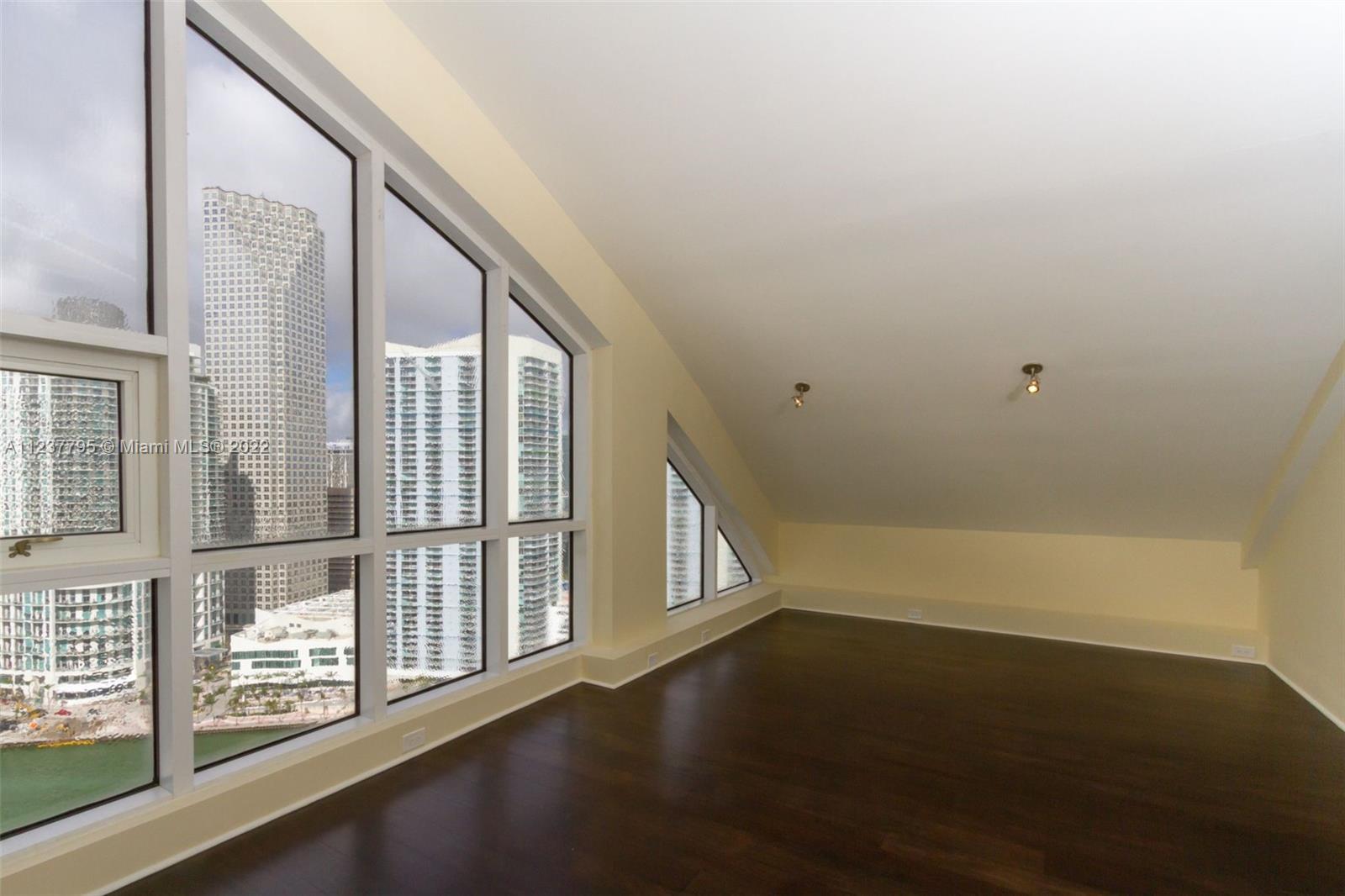 888 Brickell Key Drive, Unit PH2802 Miami, FL 33131 - Photo 32 of 47 a view of an entryway with wooden floor