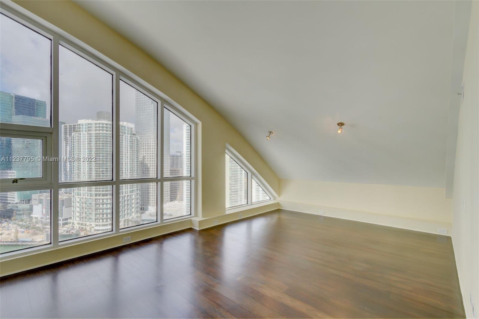 888 Brickell Key Drive, Unit PH2802 Miami, FL 33131 - Photo 33 of 47 a view of an entryway with wooden floor