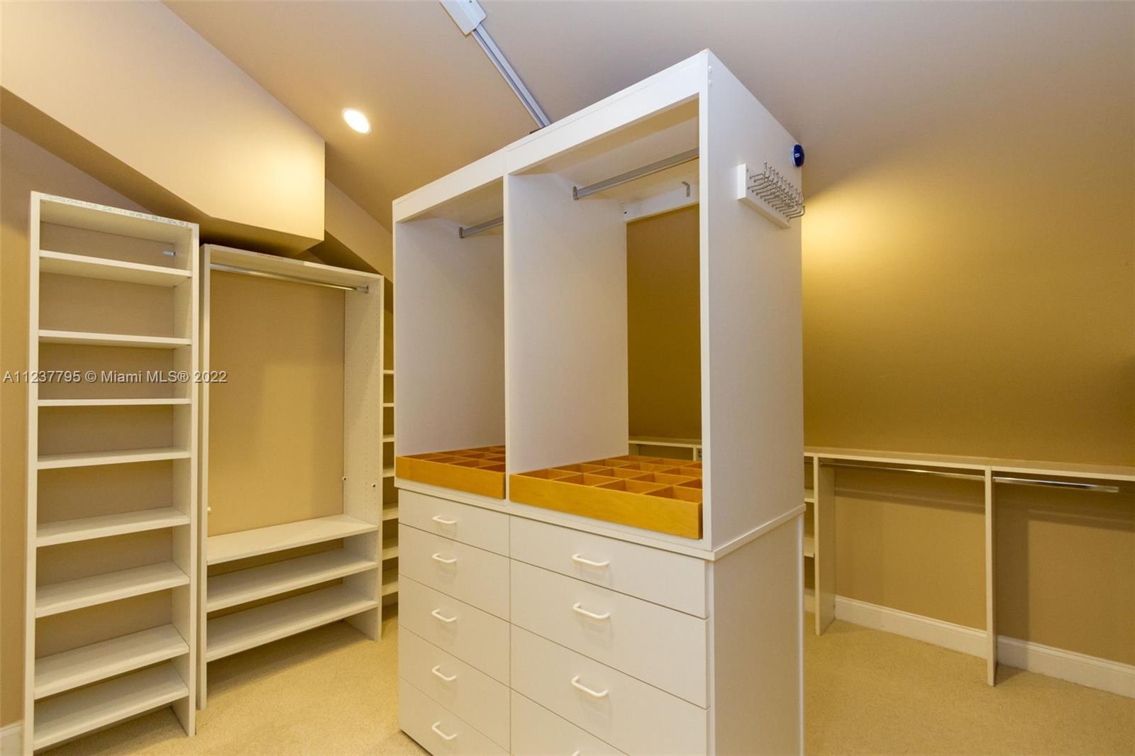 888 Brickell Key Drive, Unit PH2802 Miami, FL 33131 - Photo 41 of 47 a view of walk in closet with empty racks