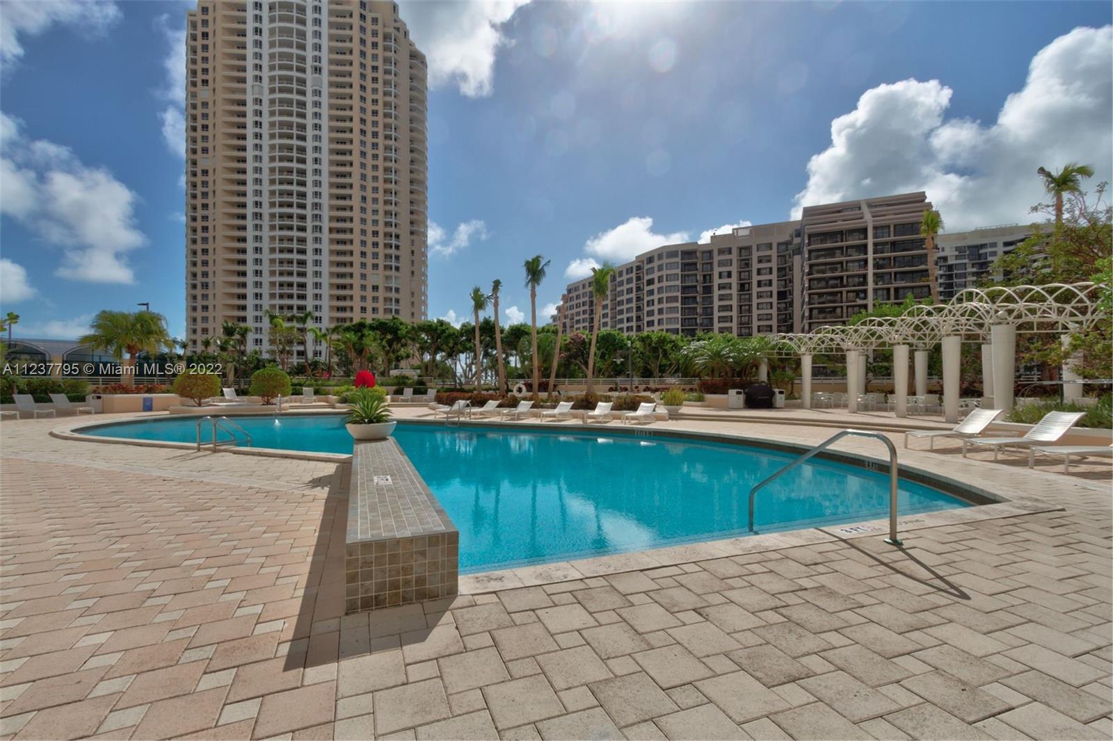888 Brickell Key Drive, Unit PH2802 Miami, FL 33131 - Photo 45 of 47 a front view of a building with swimming pool