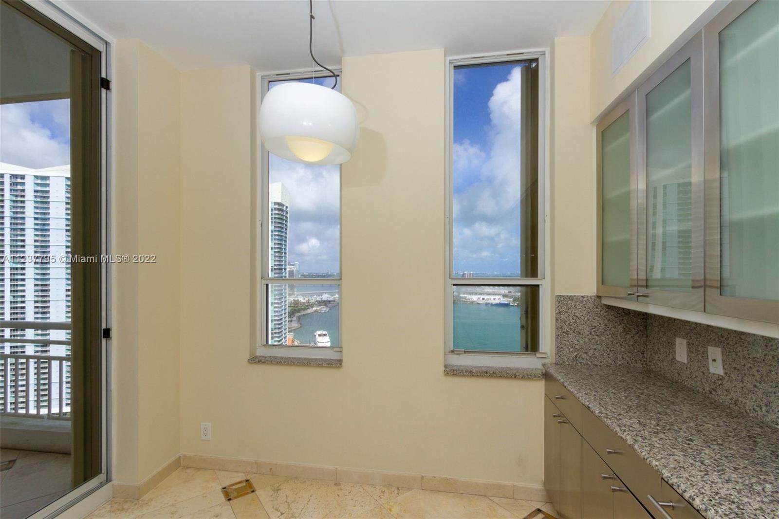 888 Brickell Key Drive, Unit PH2802 Miami, FL 33131 - Photo 8 of 47 a bathroom with a granite countertop sink and mirror