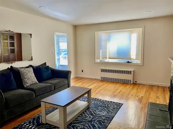 a living room with furniture and a rug