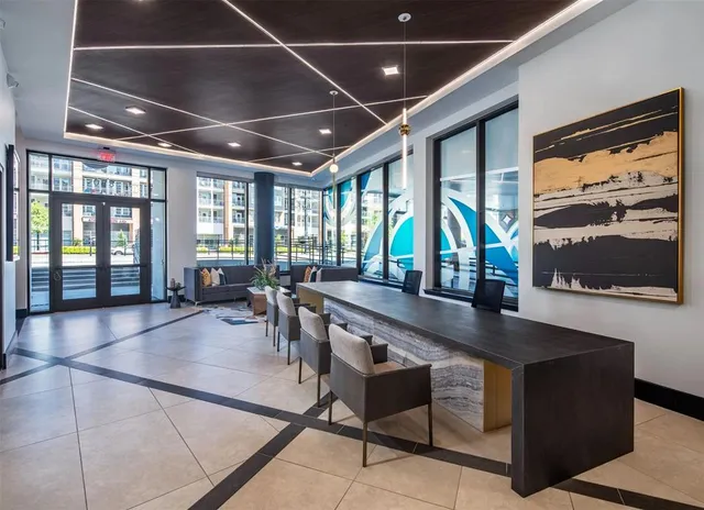 a lobby with furniture and window