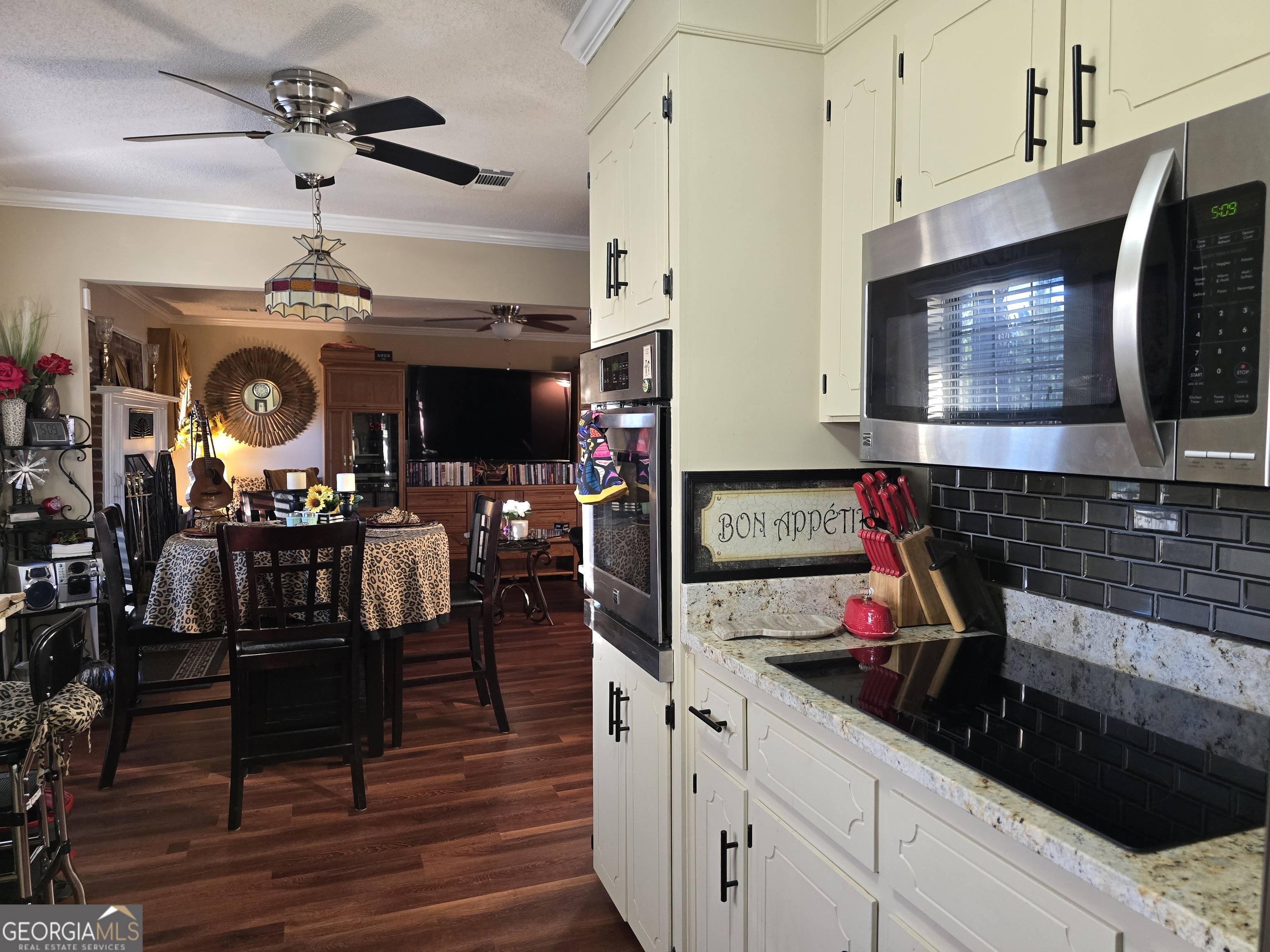 479 Mitchell Loop Bluffton, GA 39824 - Photo 13 of 51 a kitchen with a refrigerator and a stove top oven