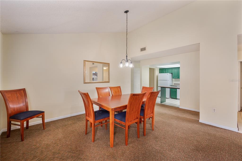 4231 Oak Loop, Unit 51 Mulberry, FL 33860 - Photo 12 of 29 a view of a dining room with furniture