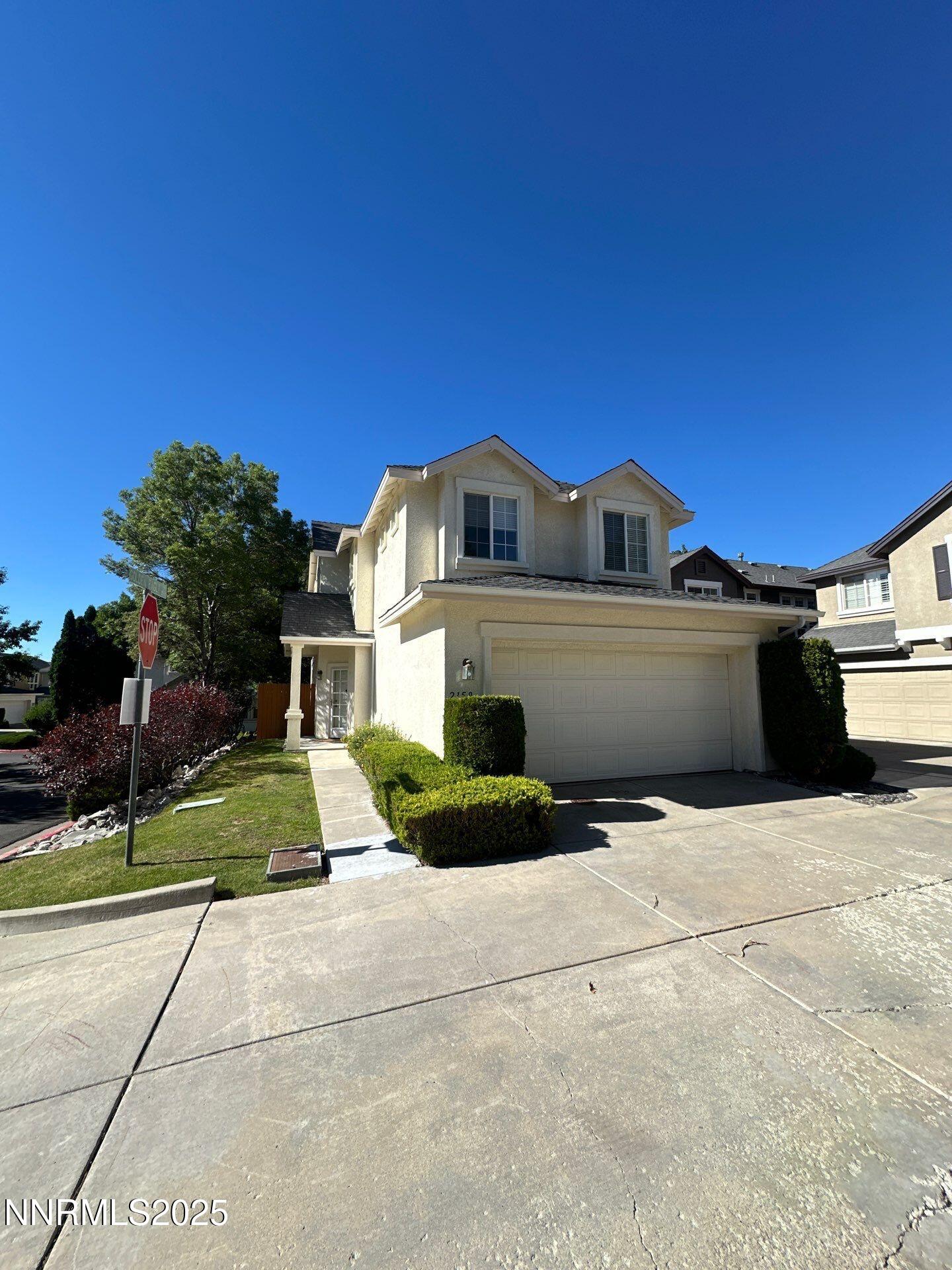 2159 Golden Eagle Court Reno, NV 89523 - Photo 2 of 18 a front view of a house with a yard