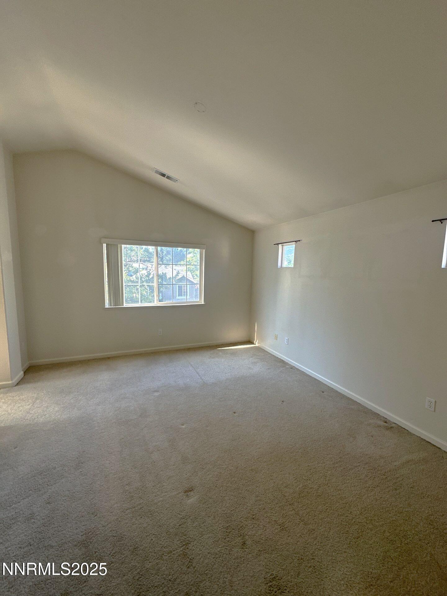 2159 Golden Eagle Court Reno, NV 89523 - Photo 7 of 18 a view of a big room with windows and chandelier fan