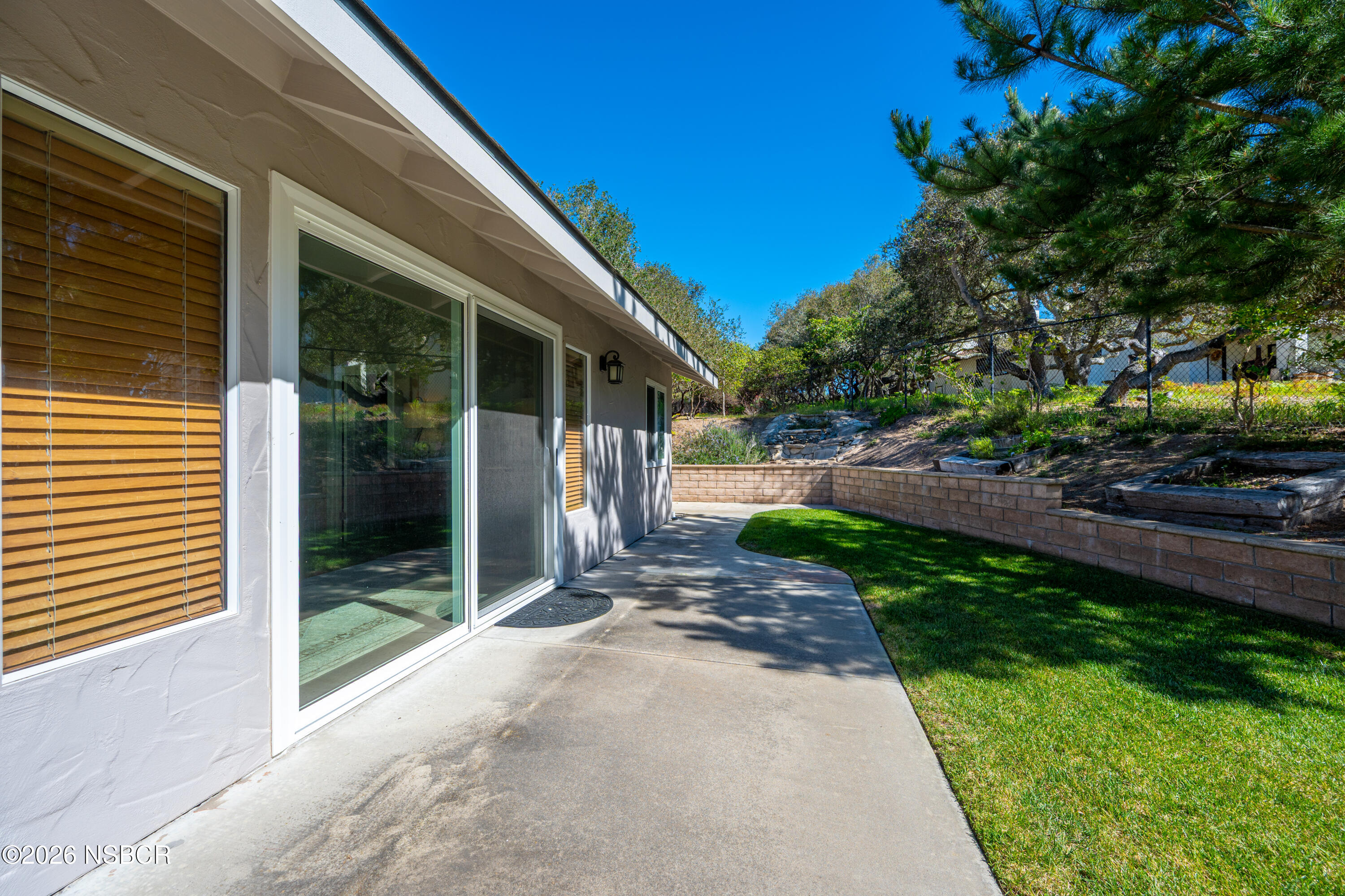 4473 Greenbrier Road Lompoc, CA 93436 - Photo 35 of 54 a view of a patio with table and chairs and potted plants