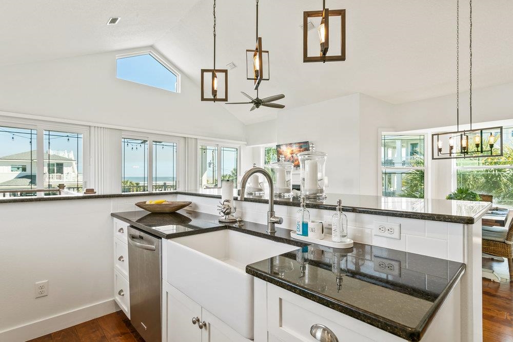 5467 Atlantic View St. Augustine, FL 32080 - Photo 17 of 42 a kitchen with granite countertop a sink stainless steel appliances and cabinets