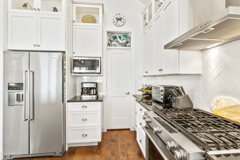 5467 Atlantic View St. Augustine, FL 32080 - Photo 18 of 42 a kitchen with stainless steel appliances a stove and a refrigerator