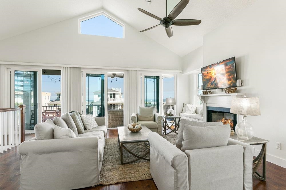 5467 Atlantic View St. Augustine, FL 32080 - Photo 23 of 42 a living room with furniture a fireplace and a flat screen tv