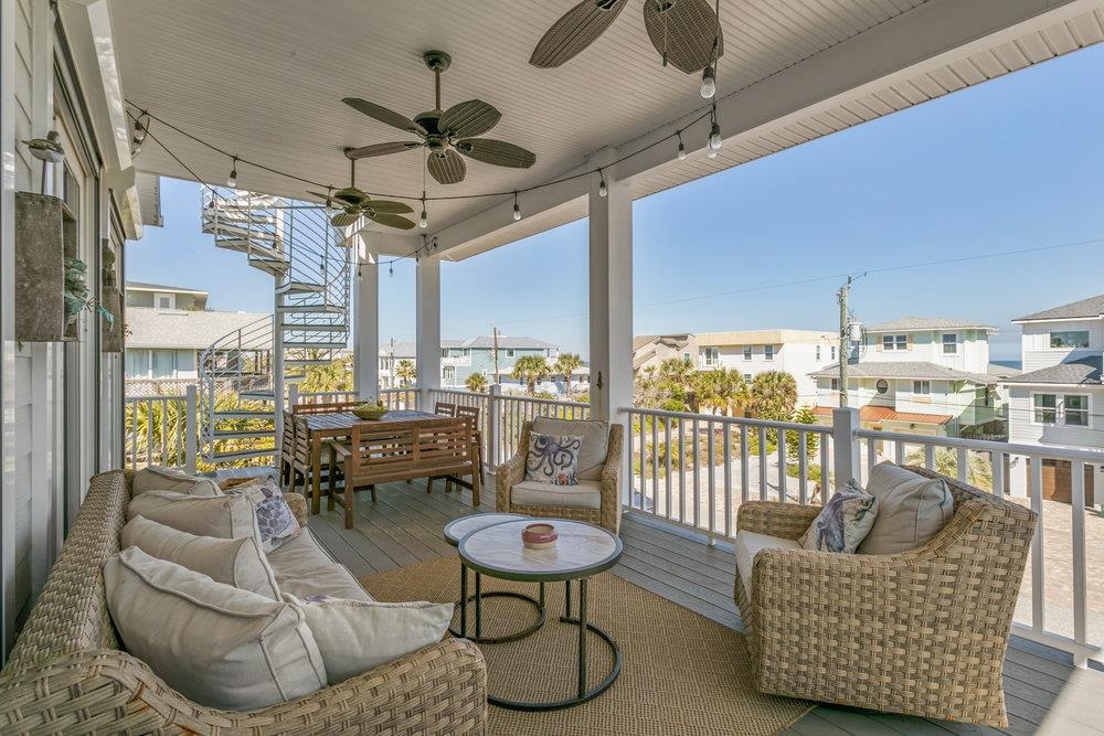 5467 Atlantic View St. Augustine, FL 32080 - Photo 25 of 42 a living room with fireplace furniture and a large window
