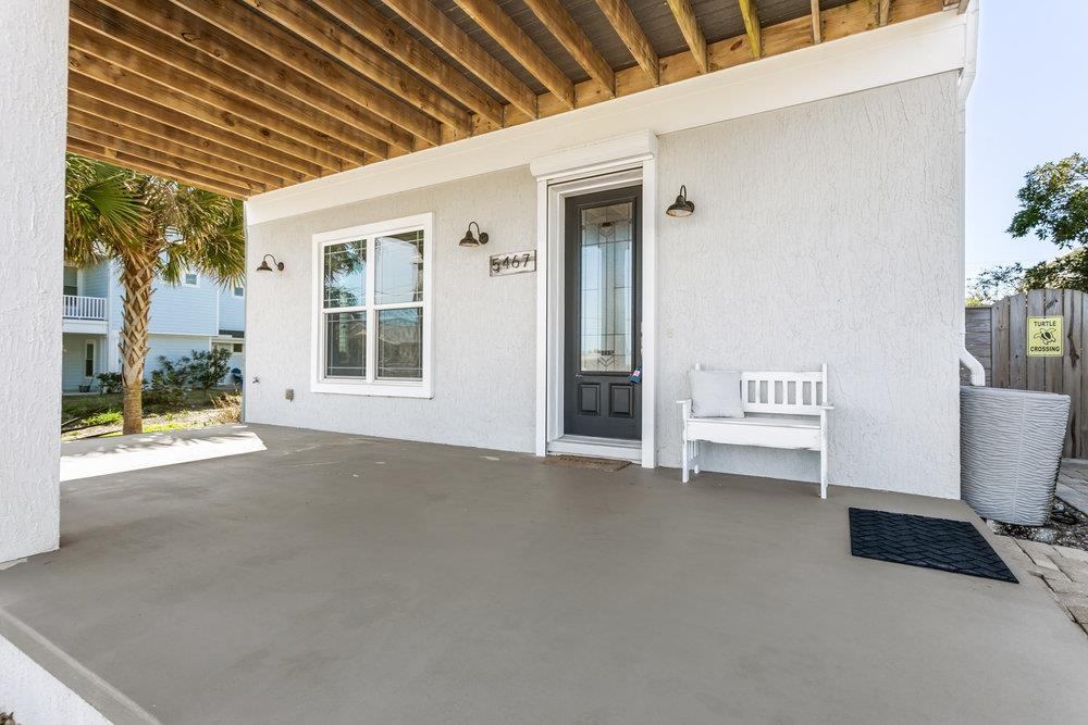 5467 Atlantic View St. Augustine, FL 32080 - Photo 3 of 42 a view of a patio with table and chairs and potted plants