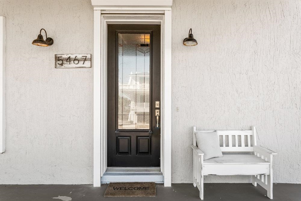 5467 Atlantic View St. Augustine, FL 32080 - Photo 4 of 42 a view of a hallway with a door and wooden floor