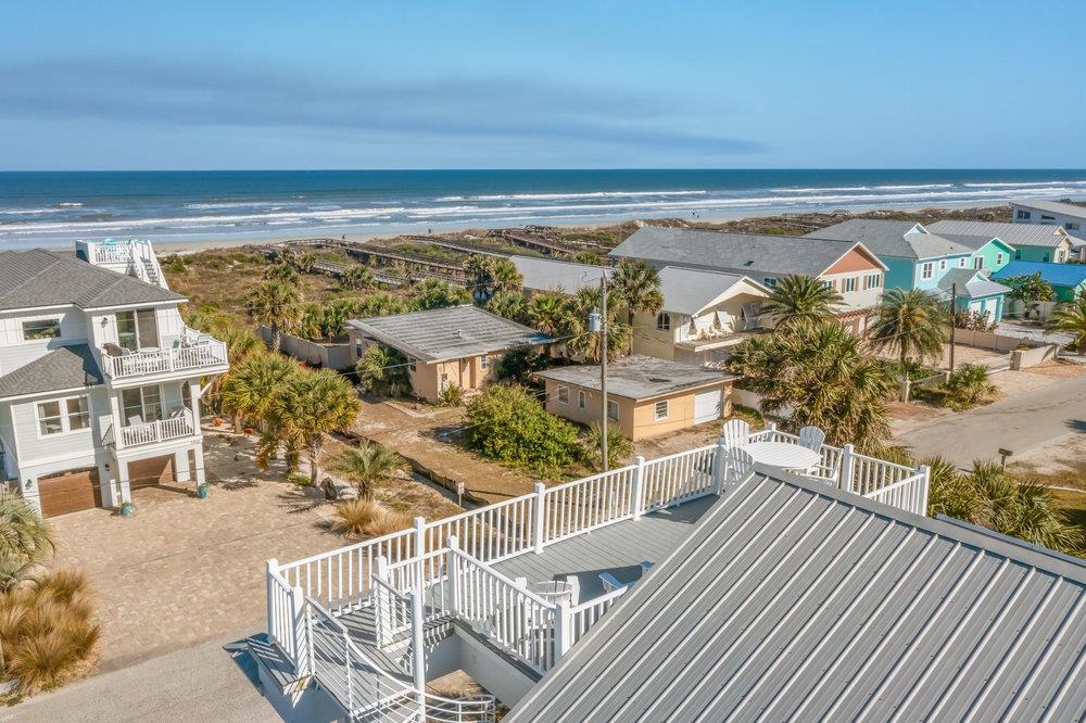 5467 Atlantic View St. Augustine, FL 32080 - Photo 42 of 42 a view of a balcony with wooden floor and iron stairs
