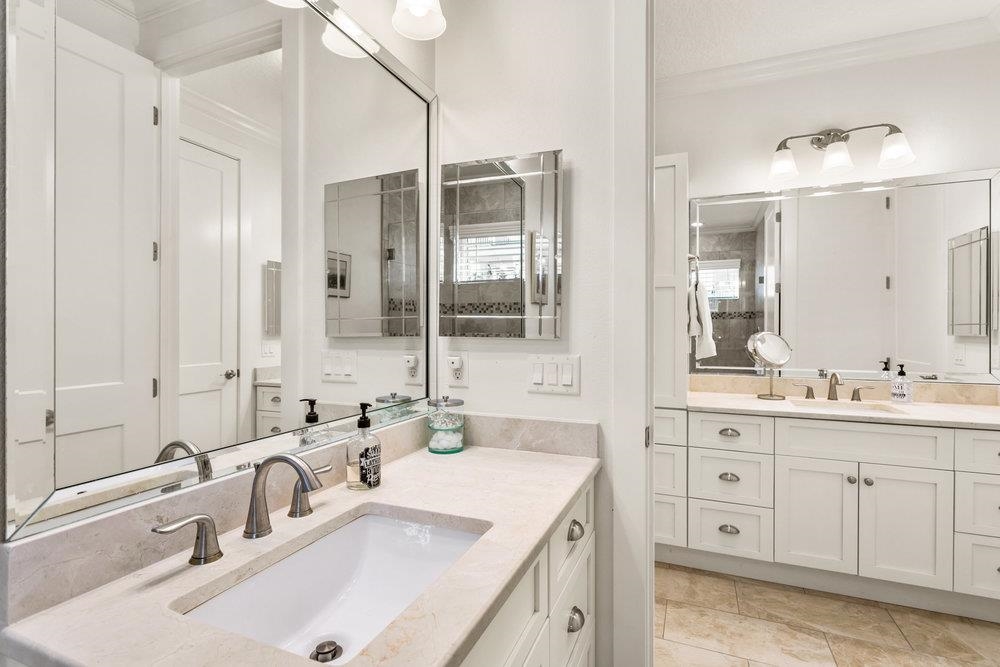 5467 Atlantic View St. Augustine, FL 32080 - Photo 7 of 42 a bathroom with double vanity sinks and a mirror