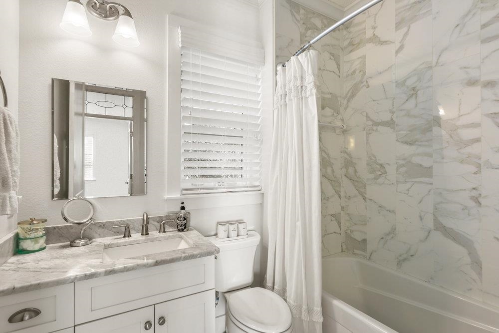 5467 Atlantic View St. Augustine, FL 32080 - Photo 10 of 42 a bathroom with a granite countertop sink toilet and shower