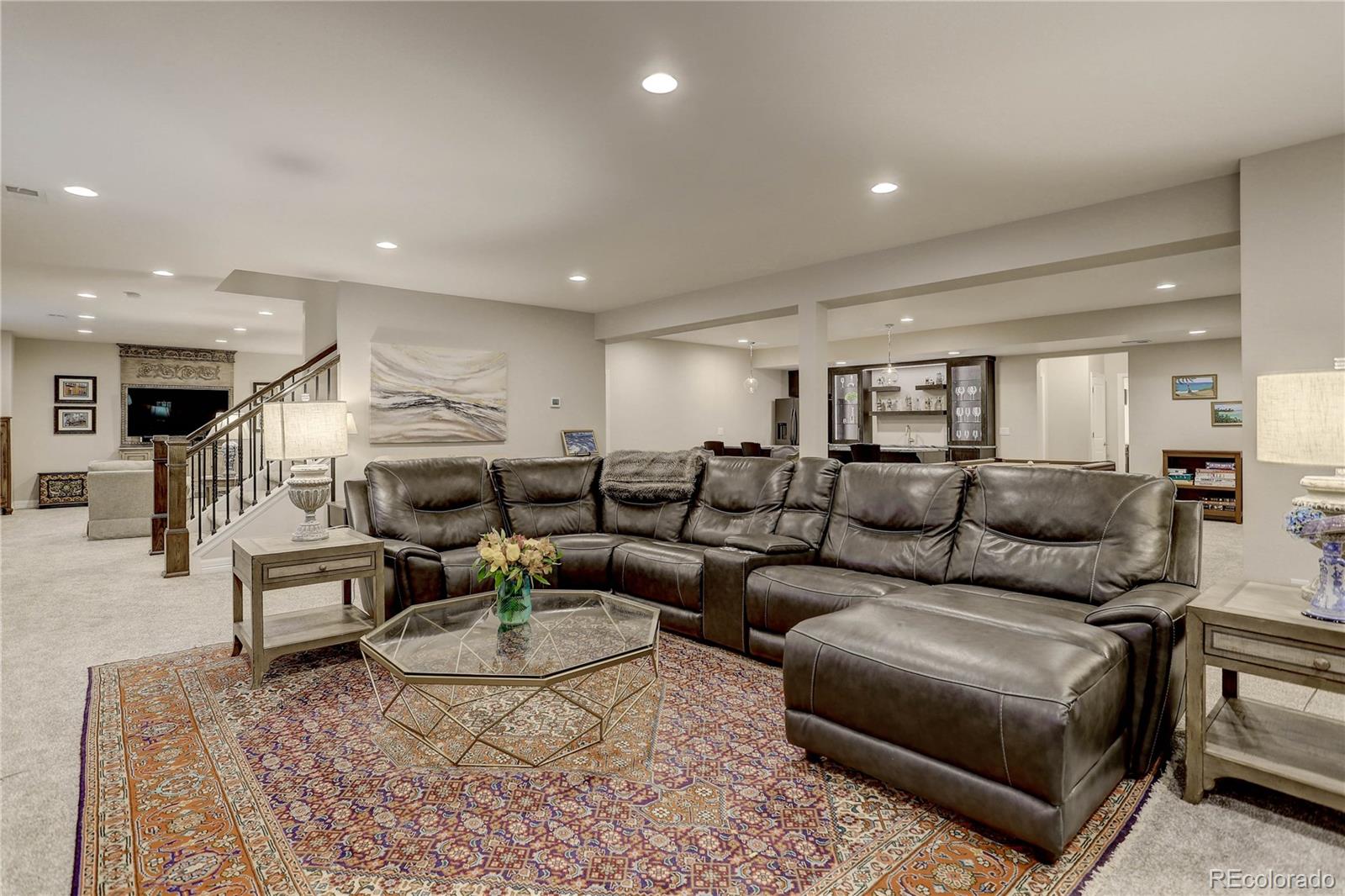 4907 Hogback Ridge Road Morrison, CO 80465 - Photo 32 of 47 a living room with furniture and a table