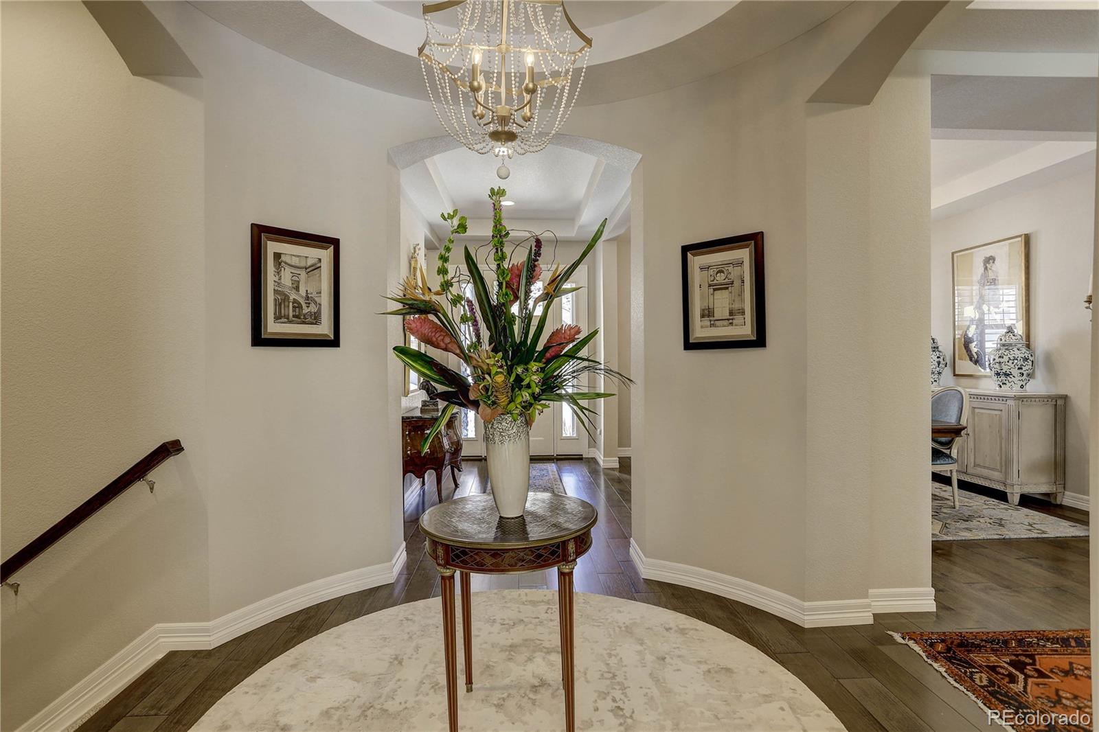 4907 Hogback Ridge Road Morrison, CO 80465 - Photo 7 of 47 a dining room with furniture and a chandelier