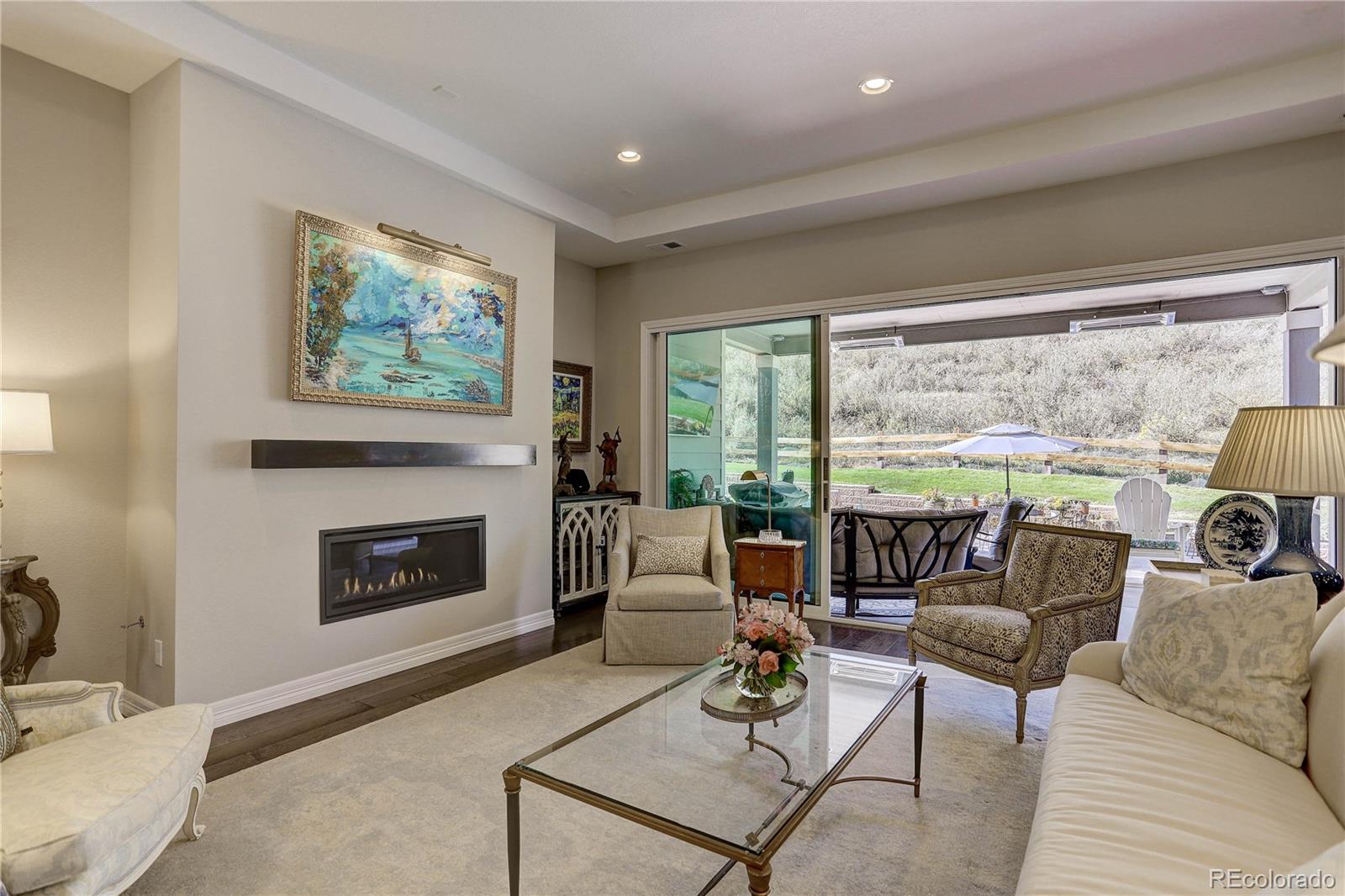 4907 Hogback Ridge Road Morrison, CO 80465 - Photo 8 of 47 a living room with furniture and a fireplace