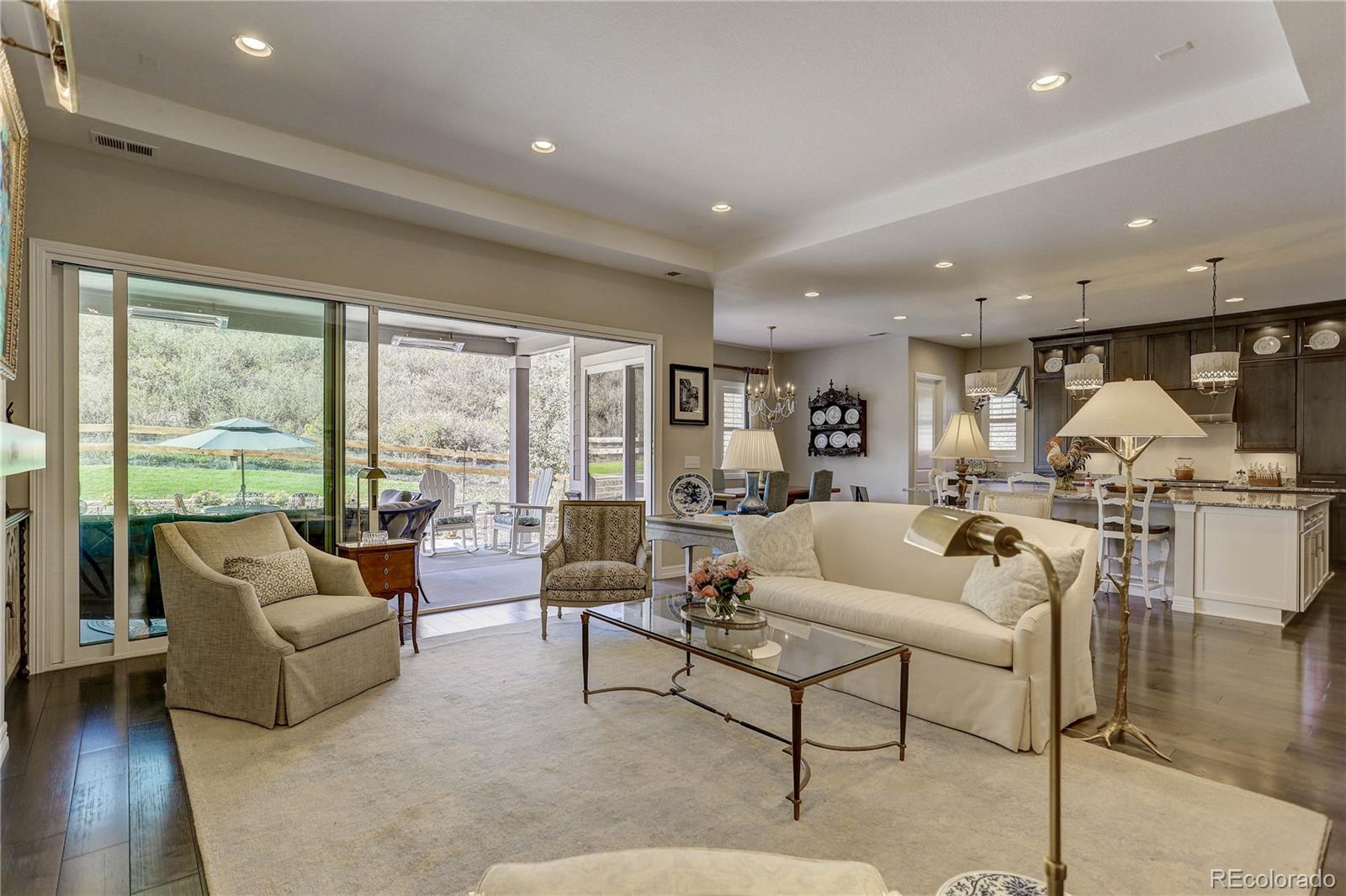 4907 Hogback Ridge Road Morrison, CO 80465 - Photo 10 of 47 a living room with furniture and a large window