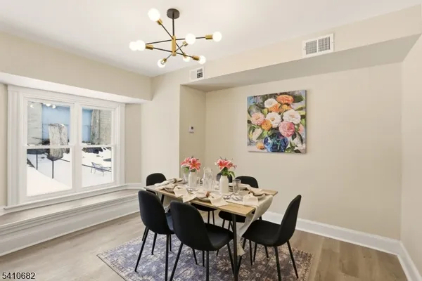 a living room with furniture and flowers