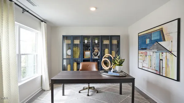 a living room with furniture and window