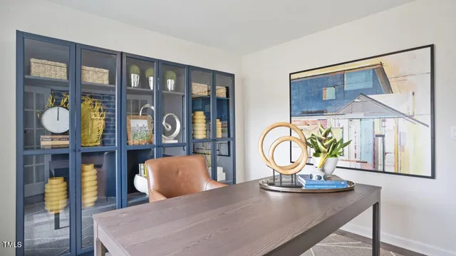 a dining room with furniture and wooden floor