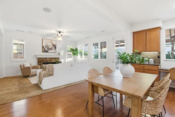 a view of a dining room with furniture and chandelier
