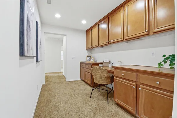 a room with cabinets a sink and a window