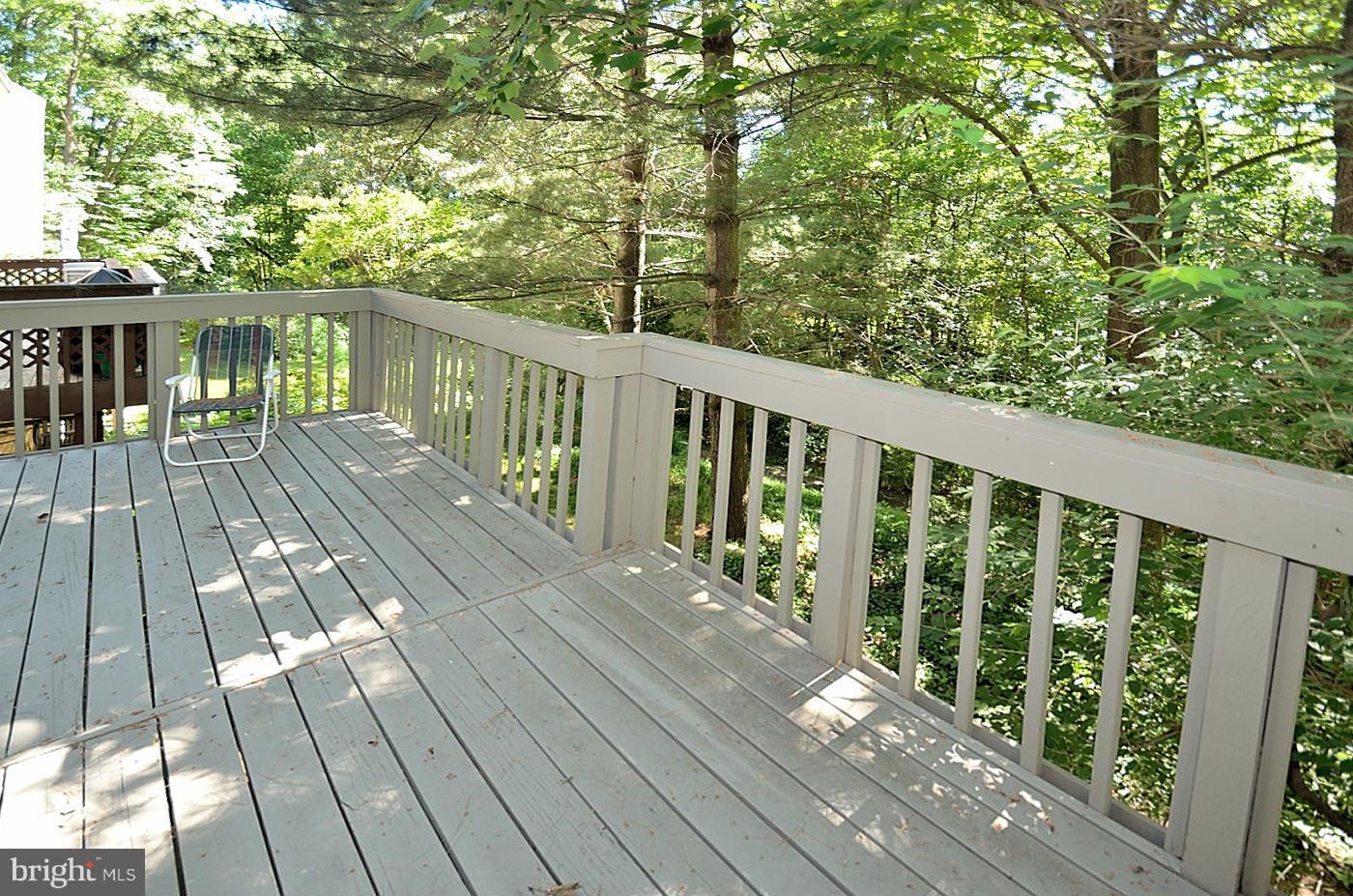 1579 Inlet Court Reston, VA 20190 - Photo 22 of 28 a view of balcony with wooden floor and fence