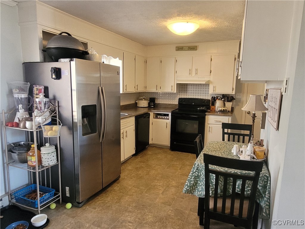 1685 Horseshoe Bend Road Keysville, VA 23947 - Photo 4 of 11 a kitchen with a refrigerator a stove and a sink
