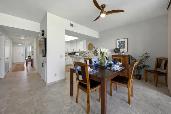 a kitchen with cabinets and stainless steel appliances