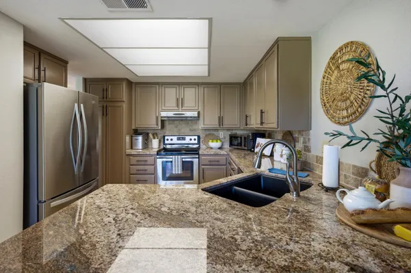 a view of kitchen and sink