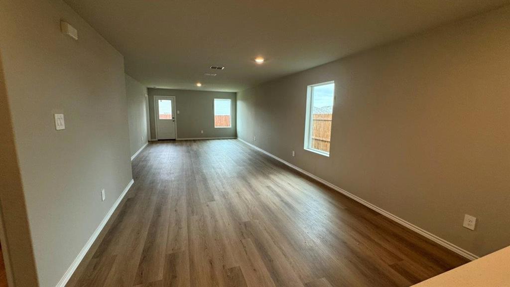 5541 Flannel Lane Krum, TX 76249 - Photo 2 of 13 a view of hallway with window and wooden floor