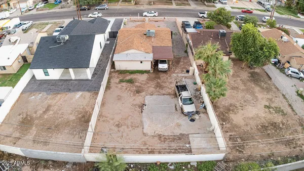 an aerial view of a house with outdoor space