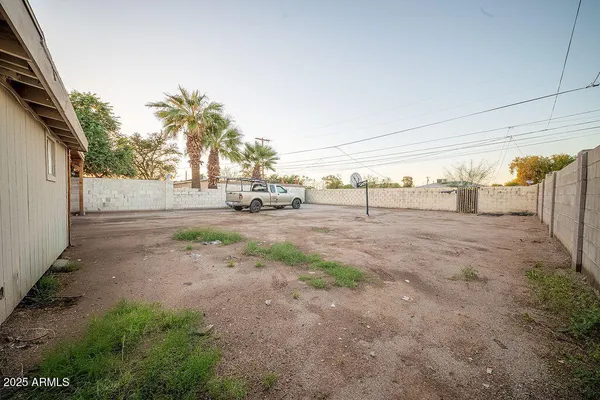 a view of a road with a building in the background