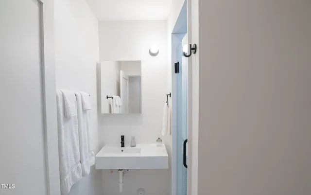 a bathroom with a sink and a mirror