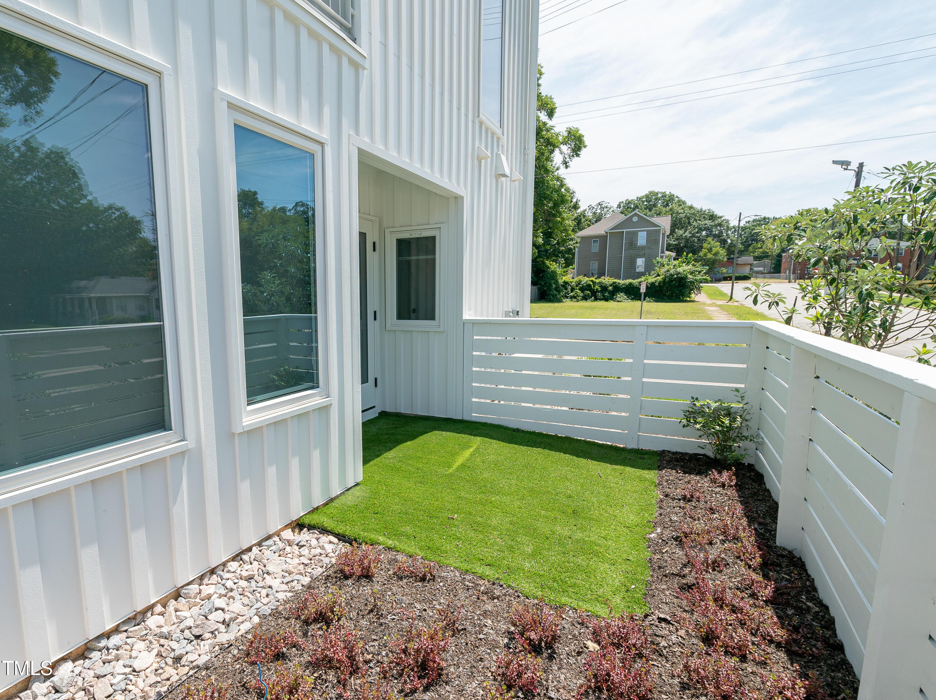 901 East Edenton Street, Unit 1 Raleigh, NC 27601 - Photo 15 of 17 a view of a porch with a yard