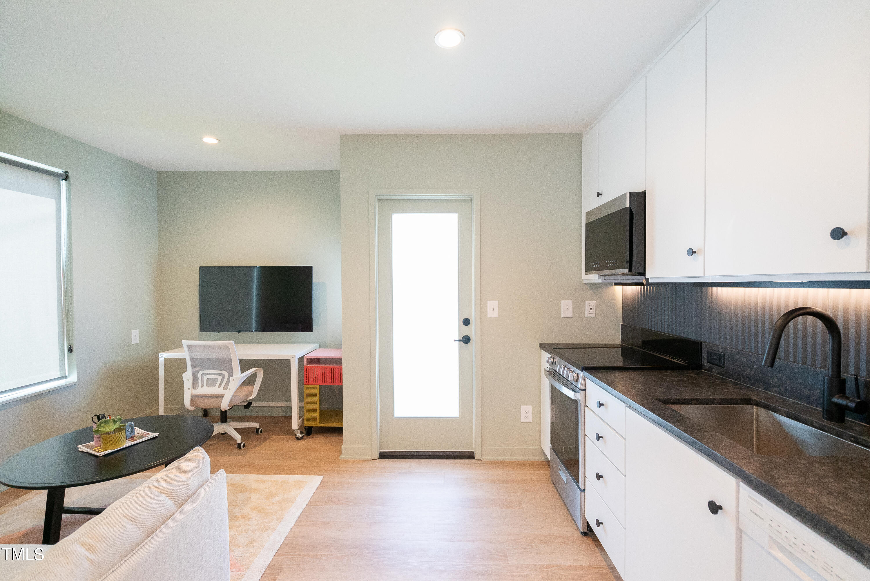901 East Edenton Street, Unit 1 Raleigh, NC 27601 - Photo 17 of 17 a kitchen that has a sink and a stove top oven