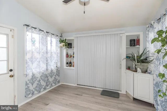 a view of entryway with wooden floor