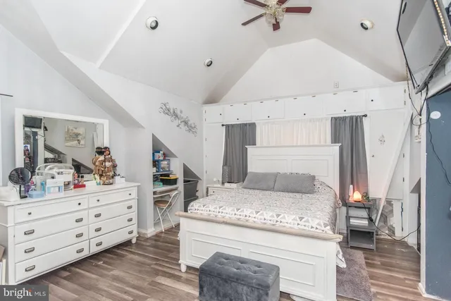 a bed room with a bed and a dresser