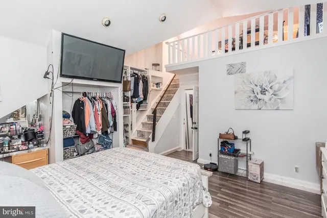 a bed room with a bed and a flat screen tv