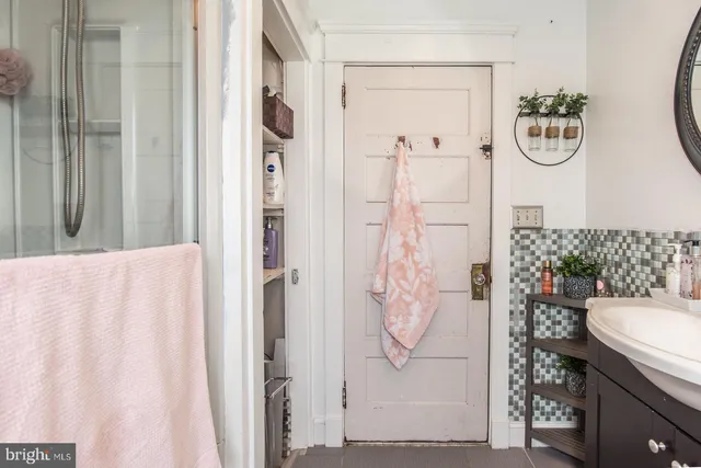 a bathroom with a sink and mirror