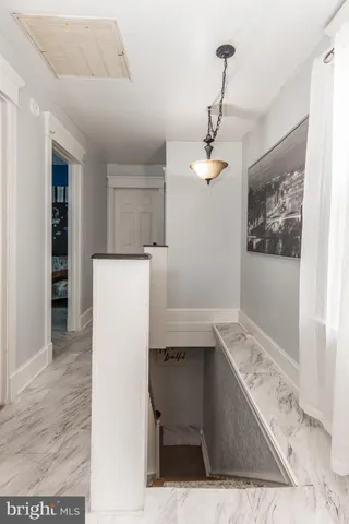 a view of kitchen with refrigerator and window