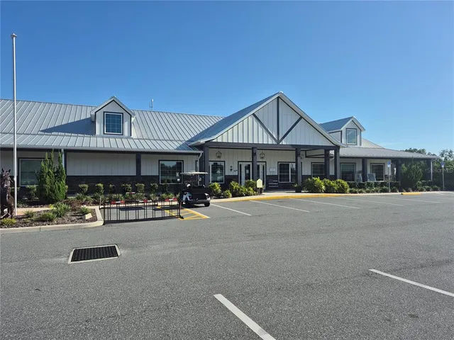 a front view of a house with sitting area