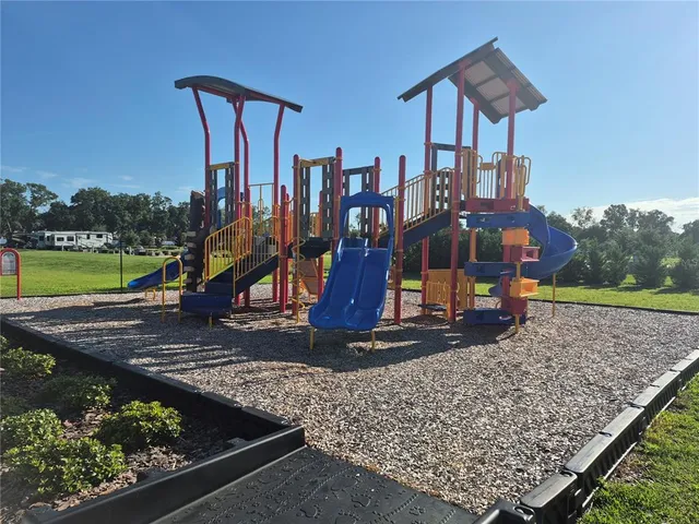 a view of a park with iron fence