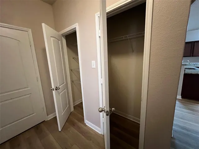 a view of front door with wooden floor