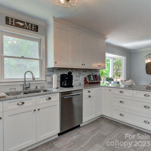 900 Woodland Forest Road Marvin, NC 28173 - Photo 11 of 36 a kitchen with cabinets appliances a sink and a window