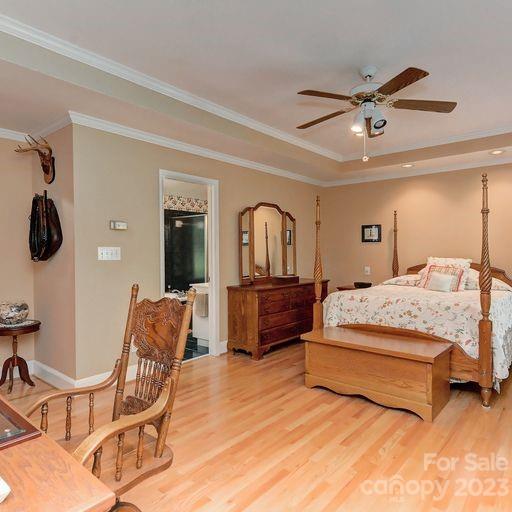900 Woodland Forest Road Marvin, NC 28173 - Photo 19 of 36 a bedroom with a bed and cabinets